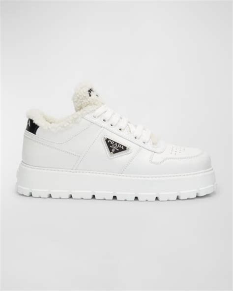 prada leather shearling platform sneakers.